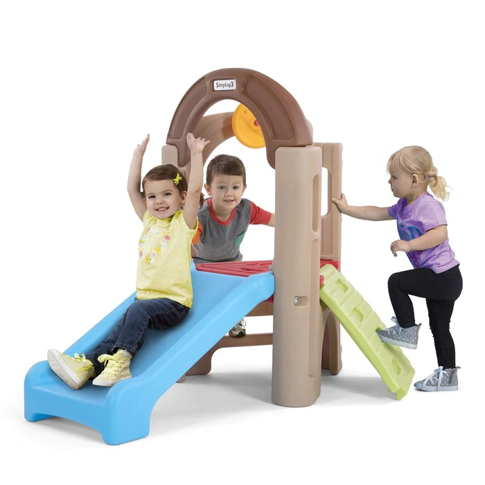 Three kids playing in modular playhouse with slide